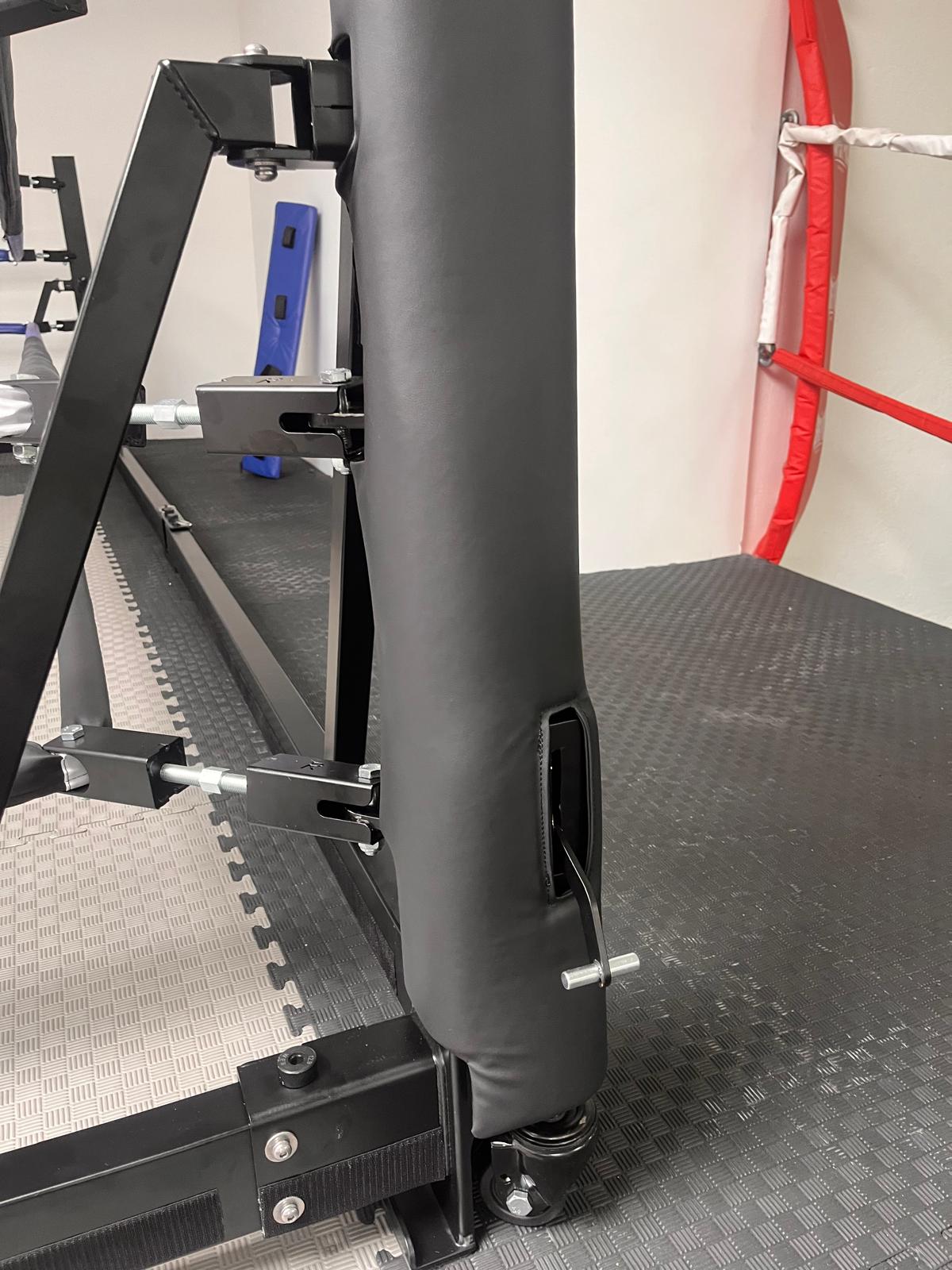 Padded post with rope tensioners and wheel of the foldable ring